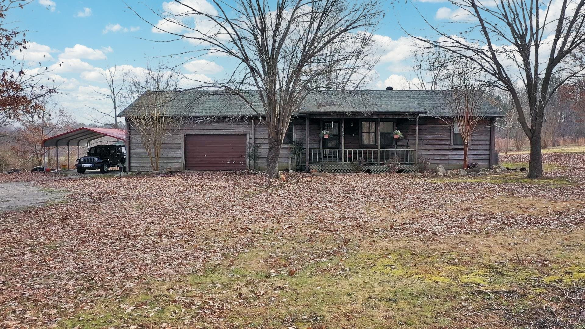 4020 Huron Road Huron, TN 38345 - Photo 16 of 24 a view of a house with a yard
