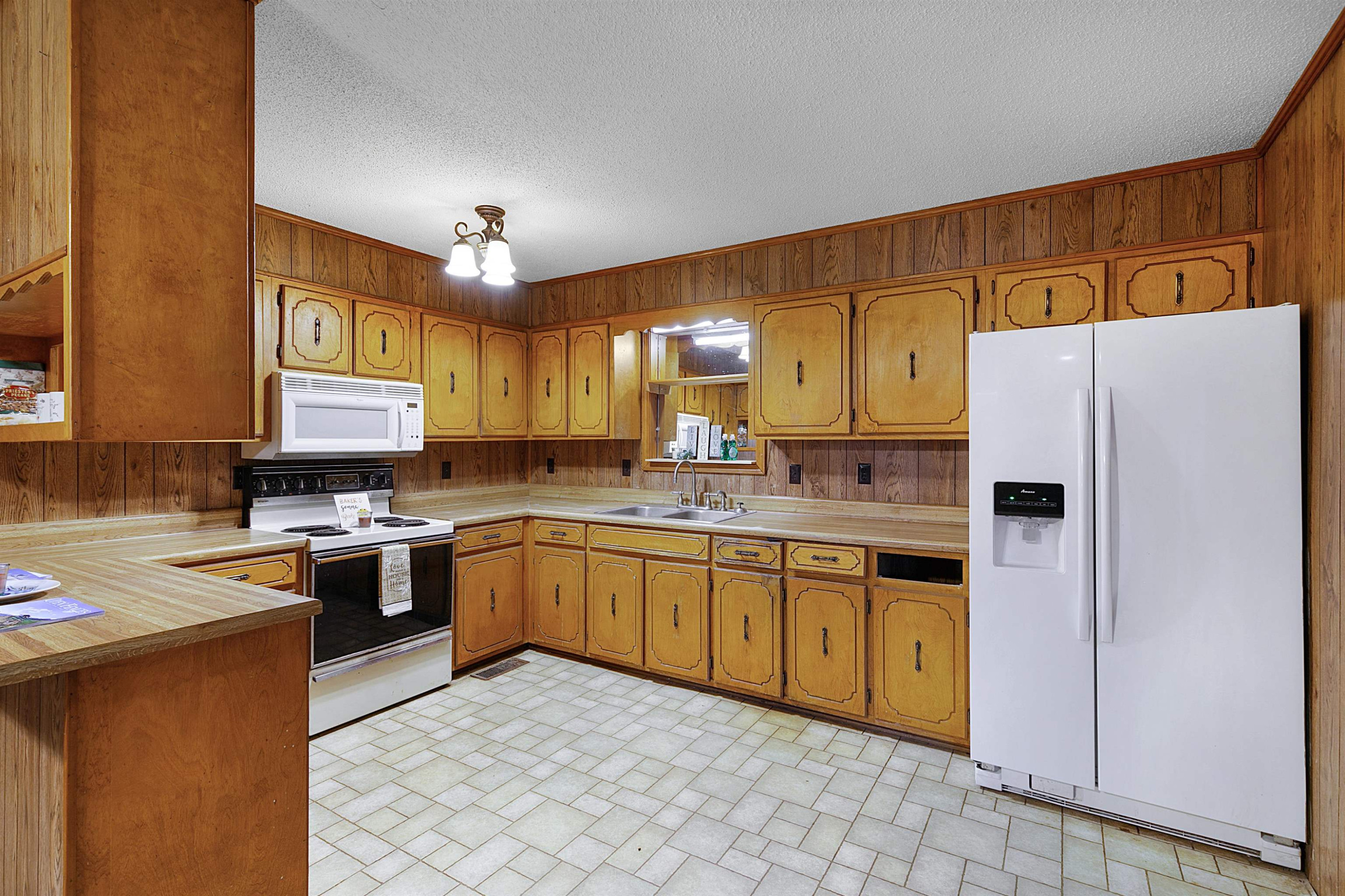 4020 Huron Road Huron, TN 38345 - Photo 2 of 24 a kitchen with stainless steel appliances granite countertop a refrigerator sink and cabinets