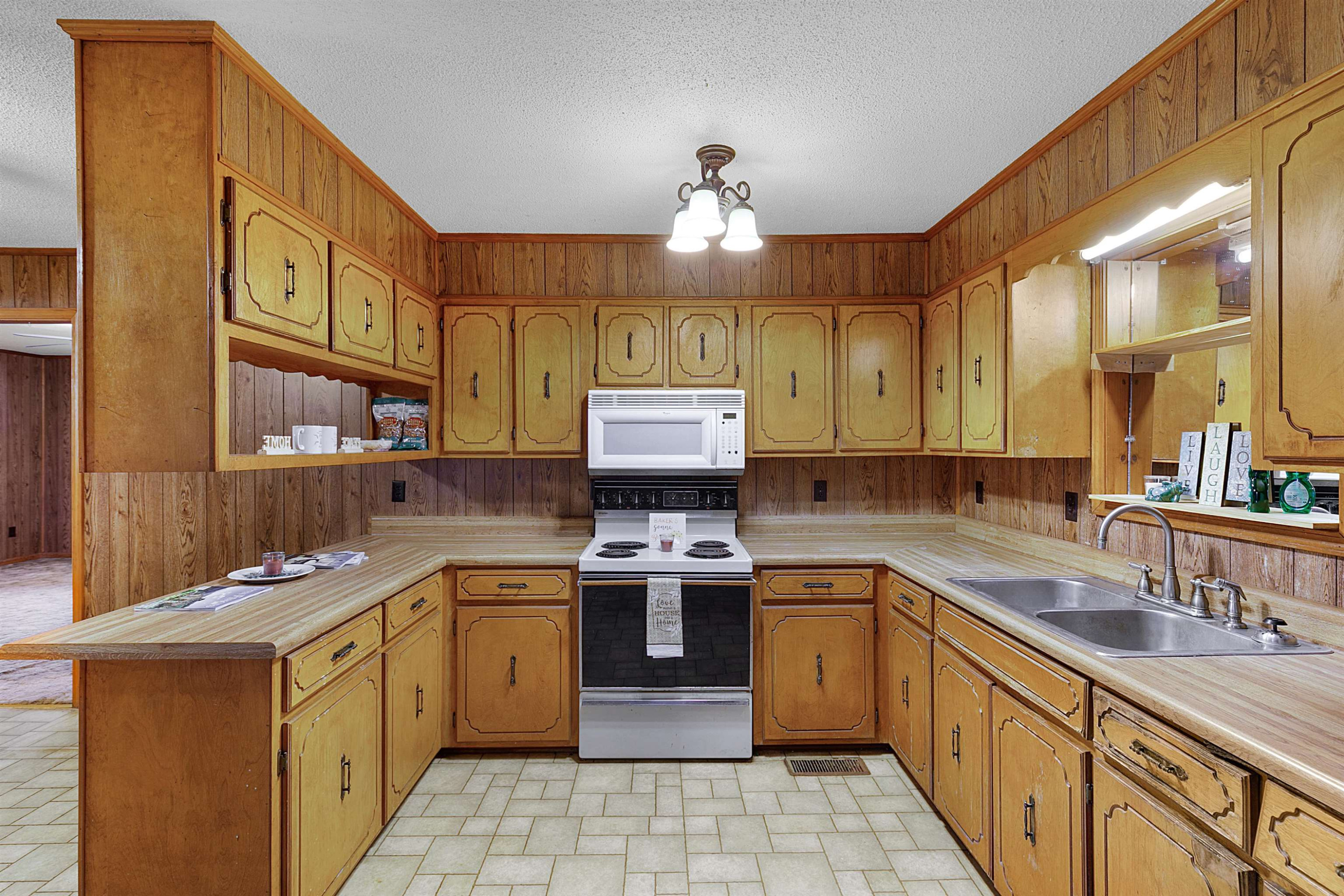 4020 Huron Road Huron, TN 38345 - Photo 3 of 24 a kitchen with a sink stove and cabinets