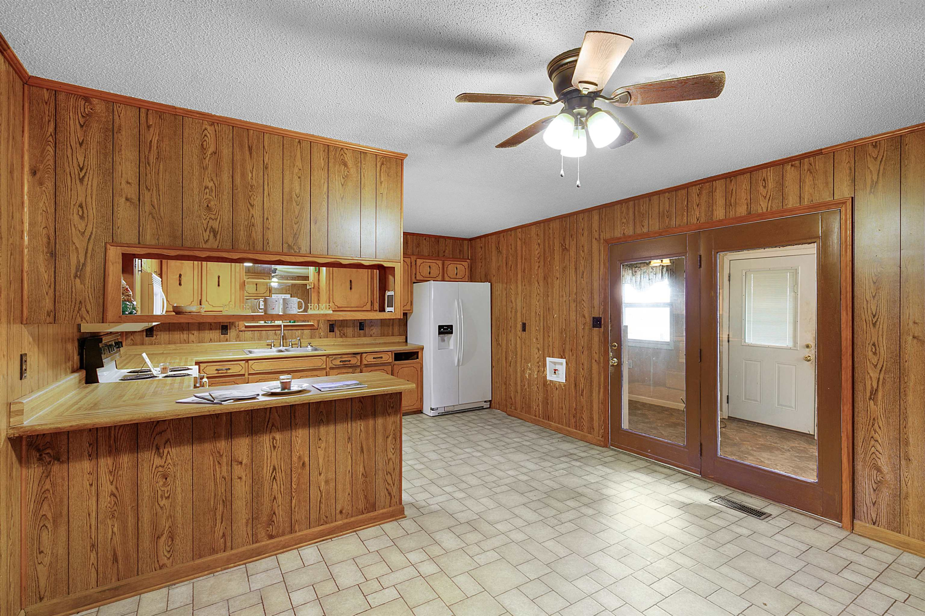 4020 Huron Road Huron, TN 38345 - Photo 5 of 24 a kitchen with a stove a refrigerator and cabinets
