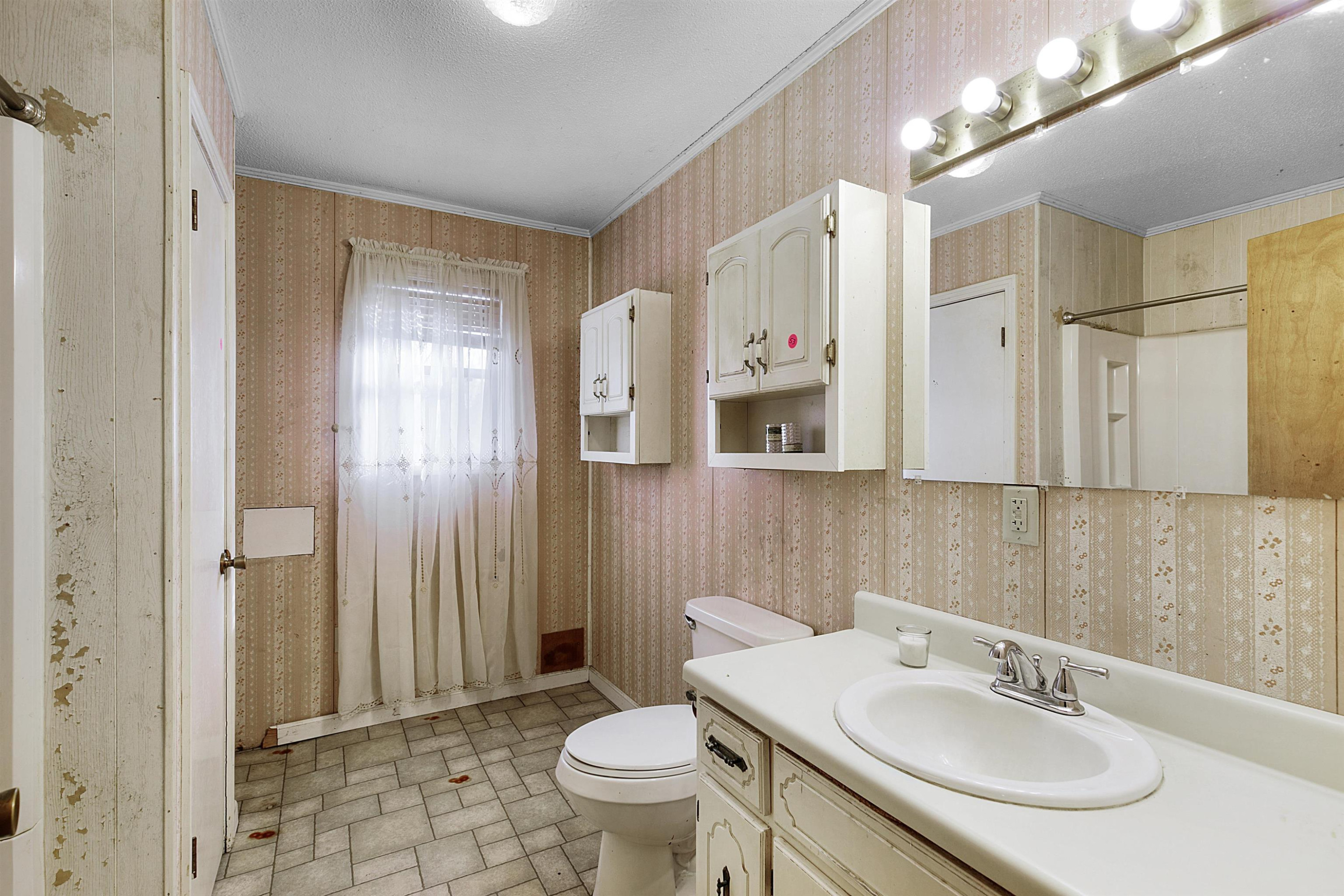 4020 Huron Road Huron, TN 38345 - Photo 9 of 24 a bathroom with a sink toilet and shower