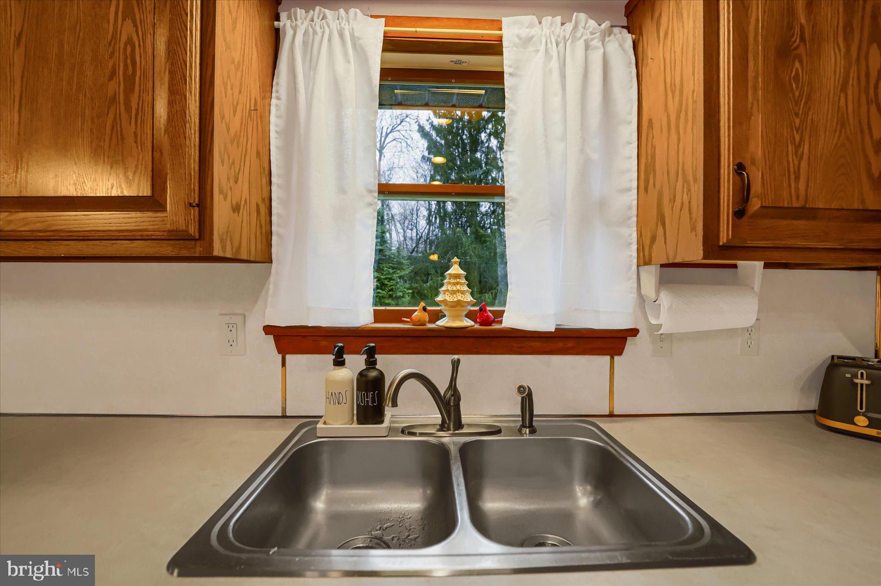 768 Dry Hollow Road Warriors Mark, PA 16877 - Photo 14 of 56 a kitchen with a sink and a window