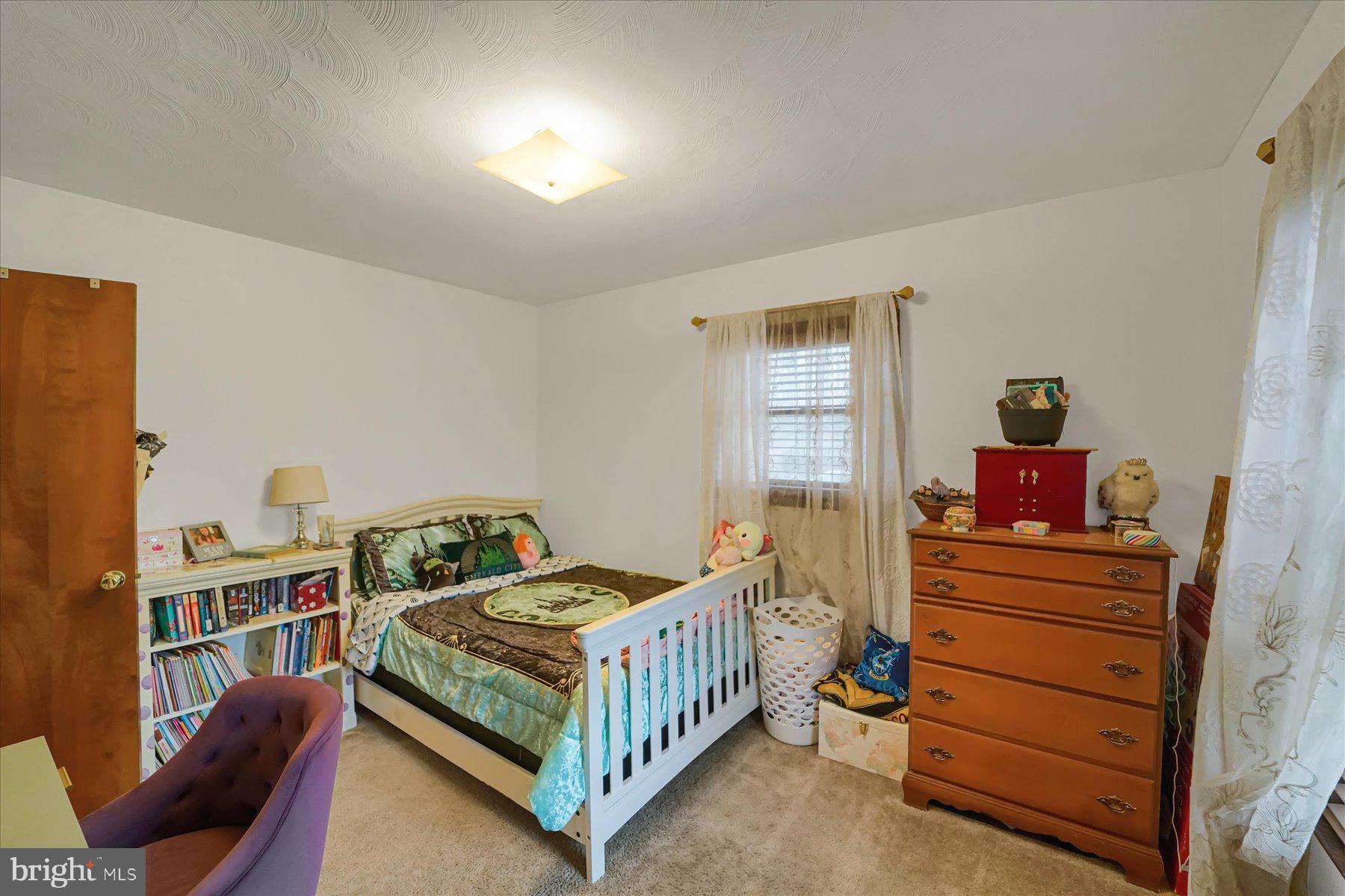 768 Dry Hollow Road Warriors Mark, PA 16877 - Photo 19 of 56 a bedroom with a bed and wooden floor