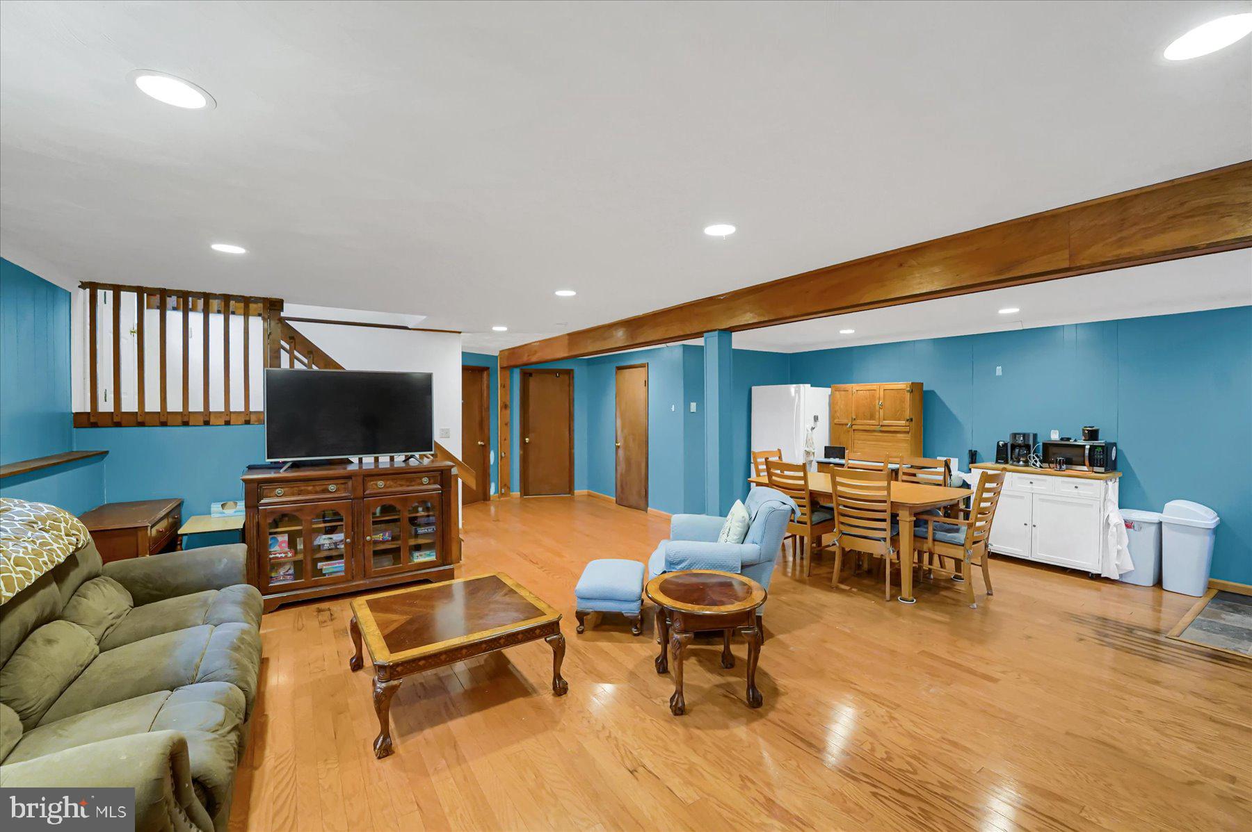 768 Dry Hollow Road Warriors Mark, PA 16877 - Photo 24 of 56 a living room with furniture a flat screen tv and kitchen view