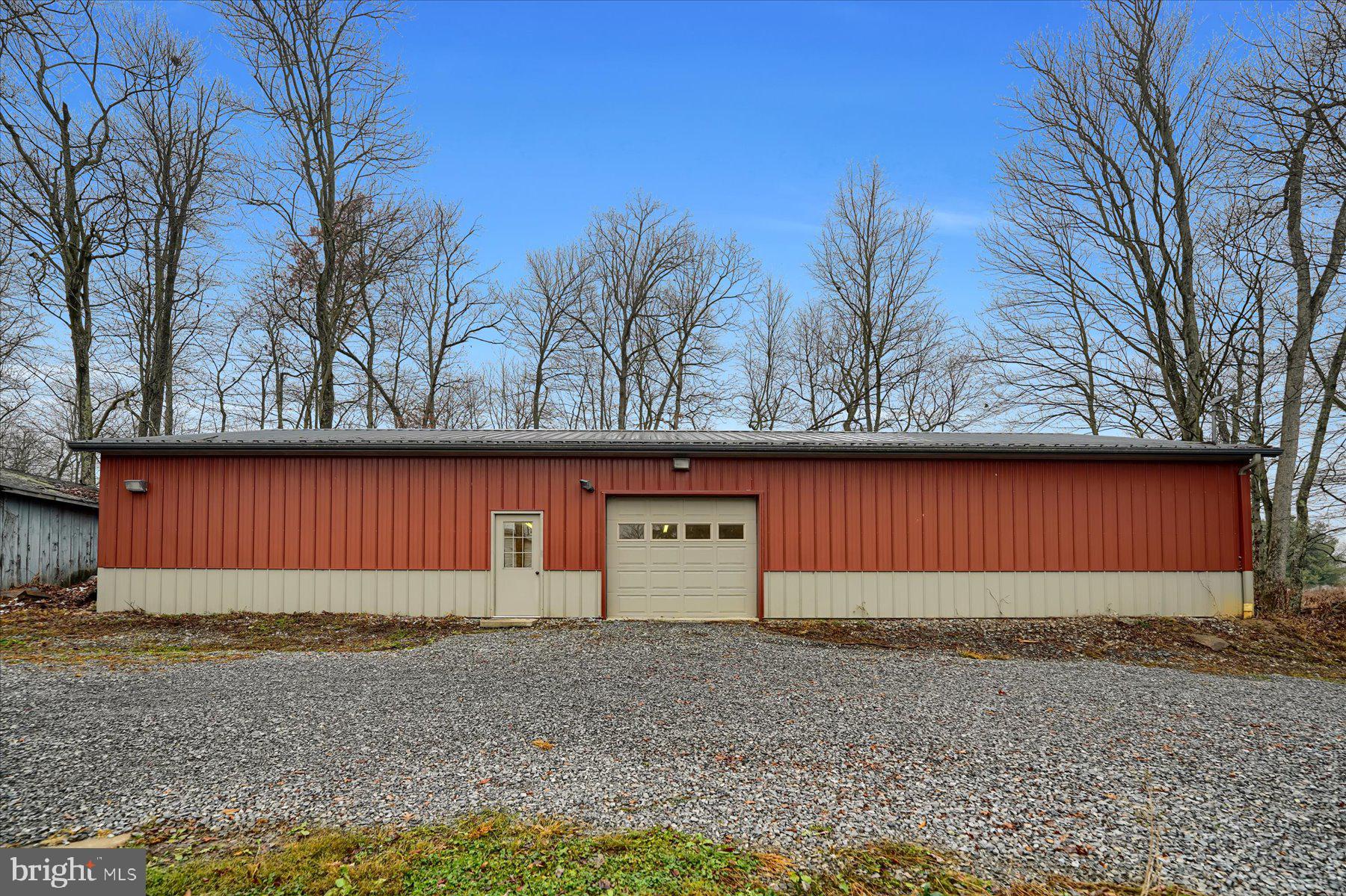 768 Dry Hollow Road Warriors Mark, PA 16877 - Photo 39 of 56 a view of a house with a yard and garage