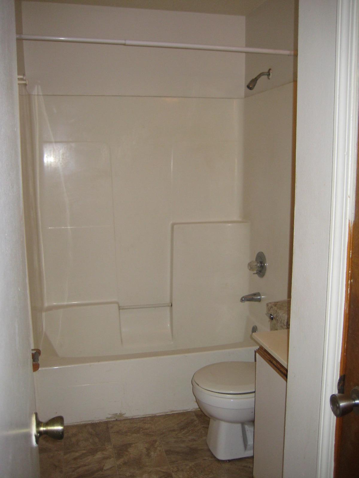 6003 Robin Road Crestview, FL 32539 - Photo 9 of 17 a bathroom with a toilet and a shower