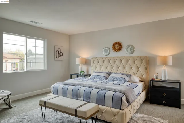 a bedroom with a bed and window