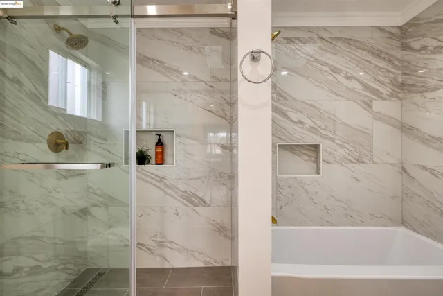 a bathroom with a bathtub and a shower