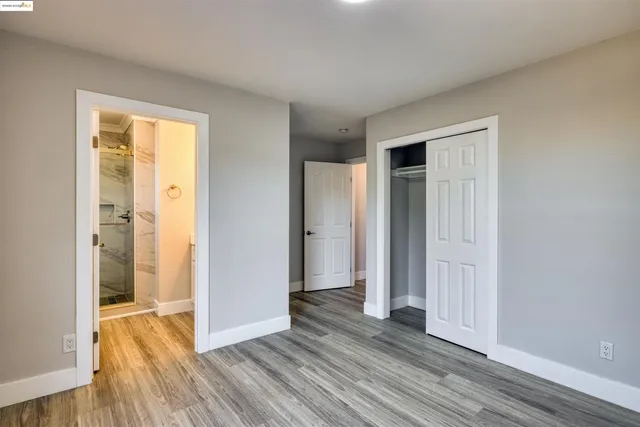 a view of hallway with wooden floor