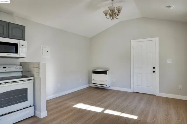a kitchen with a stove and a microwave