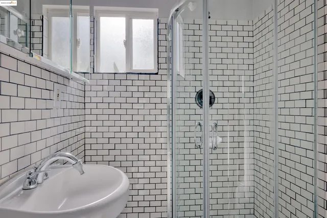 a bathroom with a sink and a shower