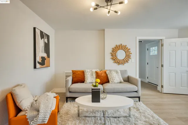 a living room with furniture and a rug