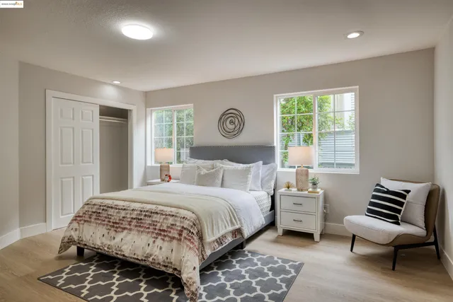 a bedroom with a bed and chair