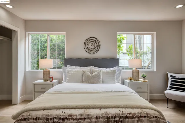 a bedroom with a bed and a lamp