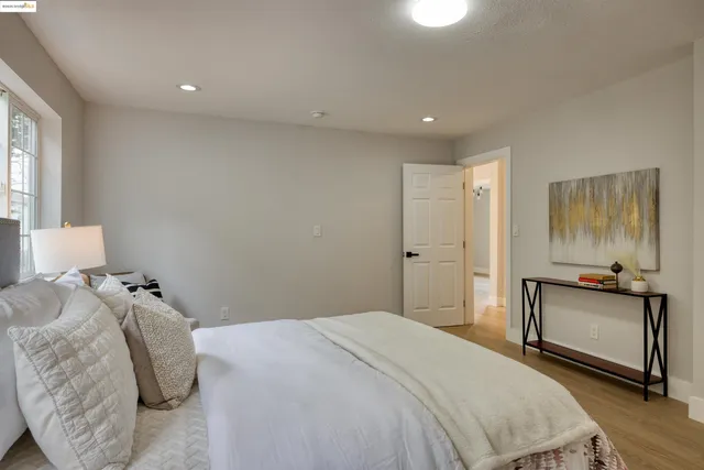 a bedroom with a bed and a couch