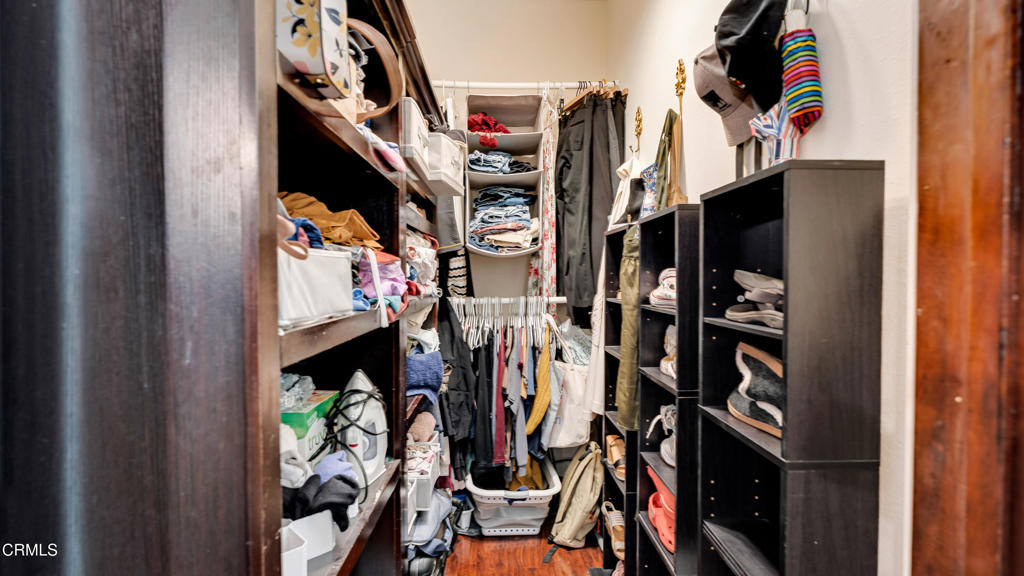 128 Lime Avenue, Unit 14 Long Beach, CA 90802 - Photo 20 of 31 a view of walk in closet with clothes and shoes