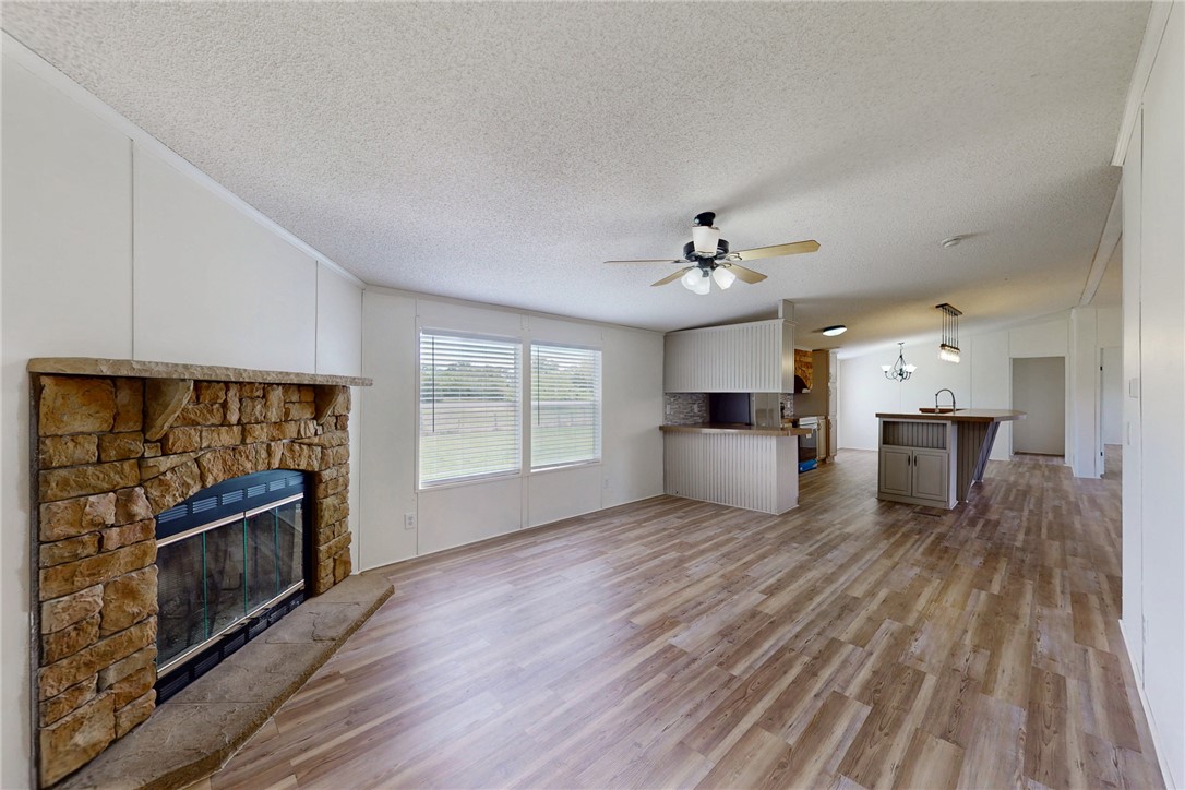 11459 Winstead Lane Calvert, TX 77837 - Photo 11 of 37 a living room with furniture and a fireplace