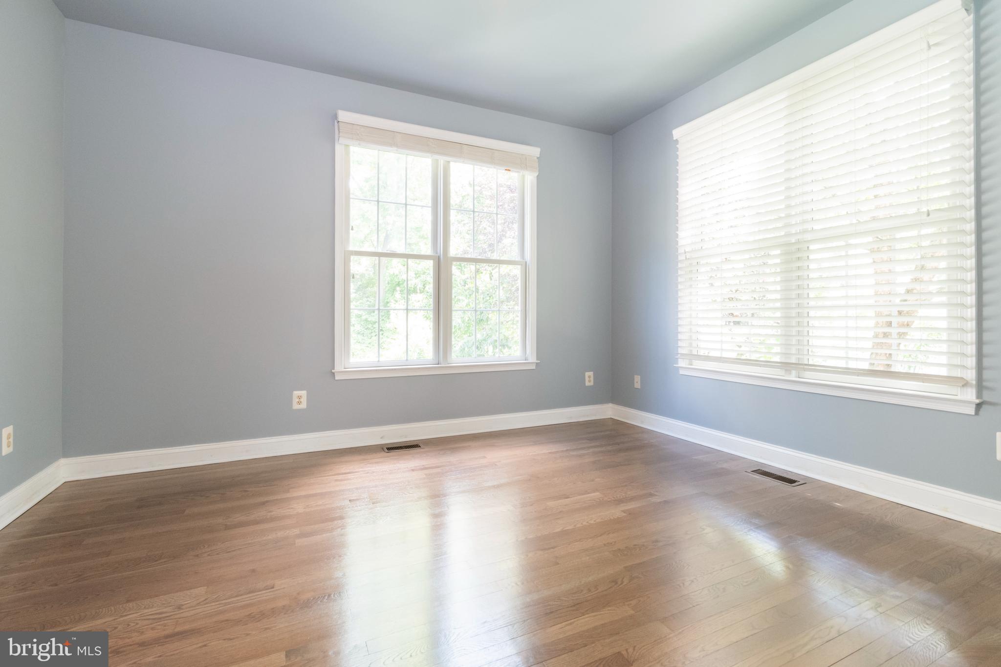 15 Johnson Road Pasadena, MD 21122 - Photo 11 of 40 a view of an empty room with wooden floor and a window