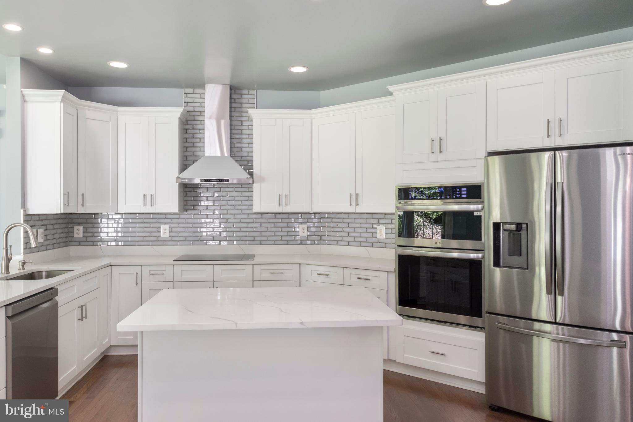 15 Johnson Road Pasadena, MD 21122 - Photo 20 of 40 a kitchen with stainless steel appliances a refrigerator sink and microwave