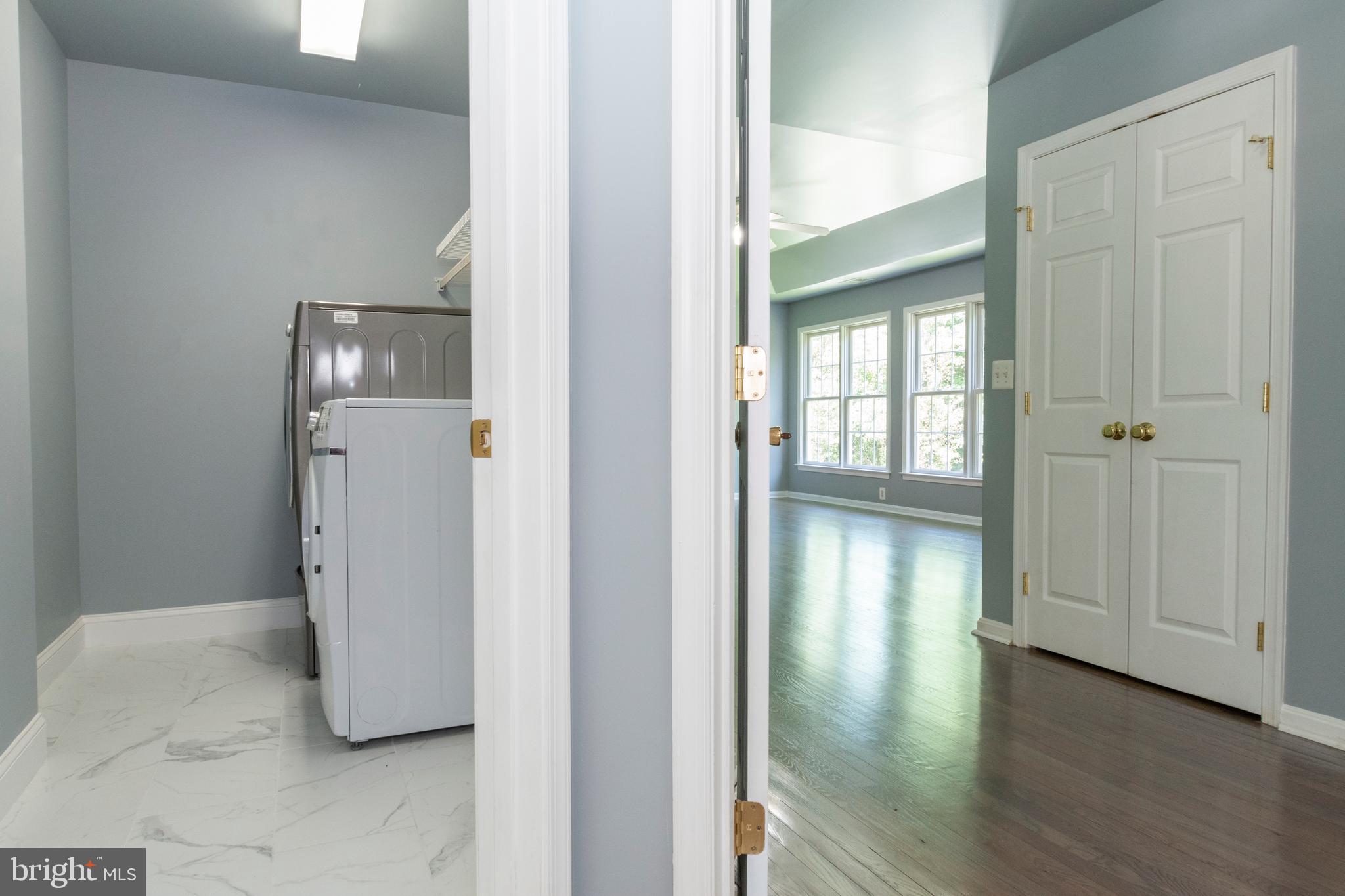 15 Johnson Road Pasadena, MD 21122 - Photo 23 of 40 a view of a hallway with wooden floor and closet