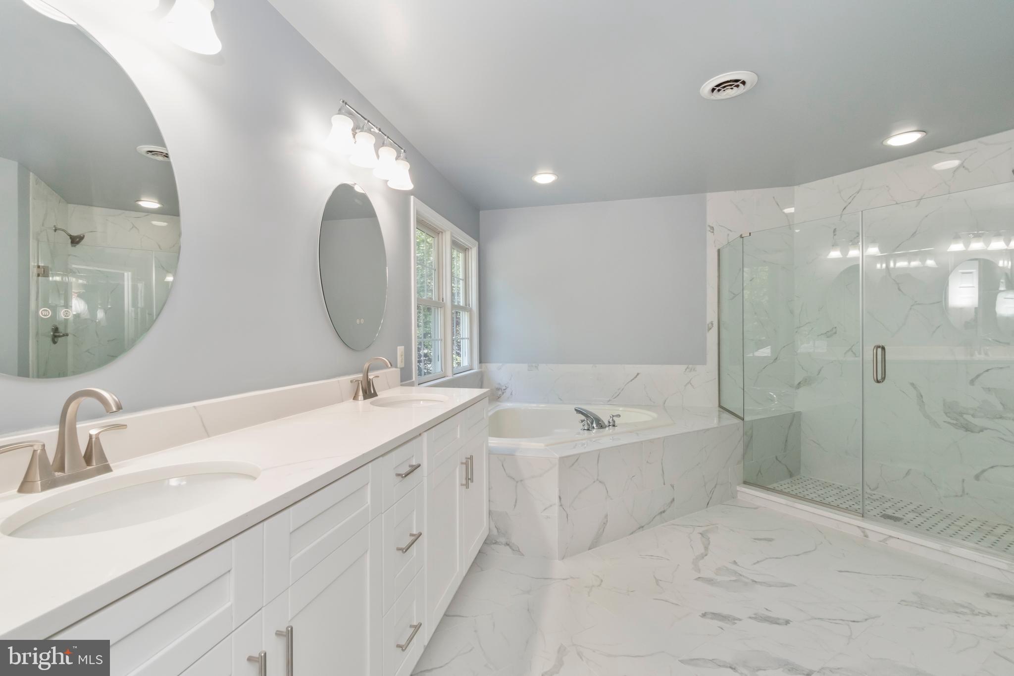 15 Johnson Road Pasadena, MD 21122 - Photo 29 of 40 a spacious bathroom with a double vanity sink mirror double and bathtub