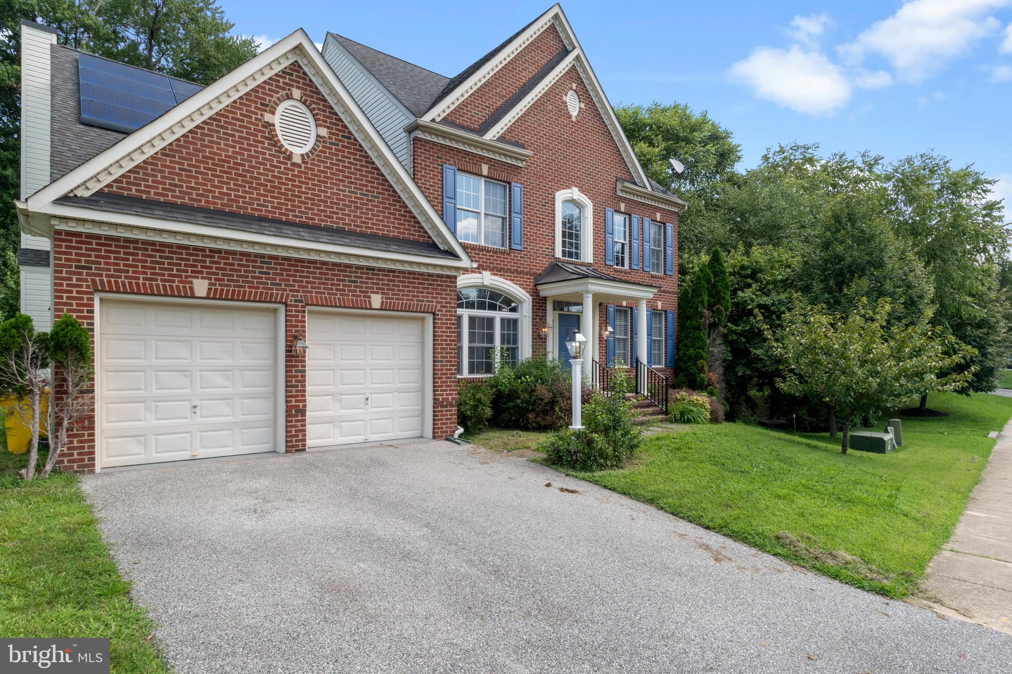 15 Johnson Road Pasadena, MD 21122 - Photo 3 of 40 a front view of a house with a yard and garage