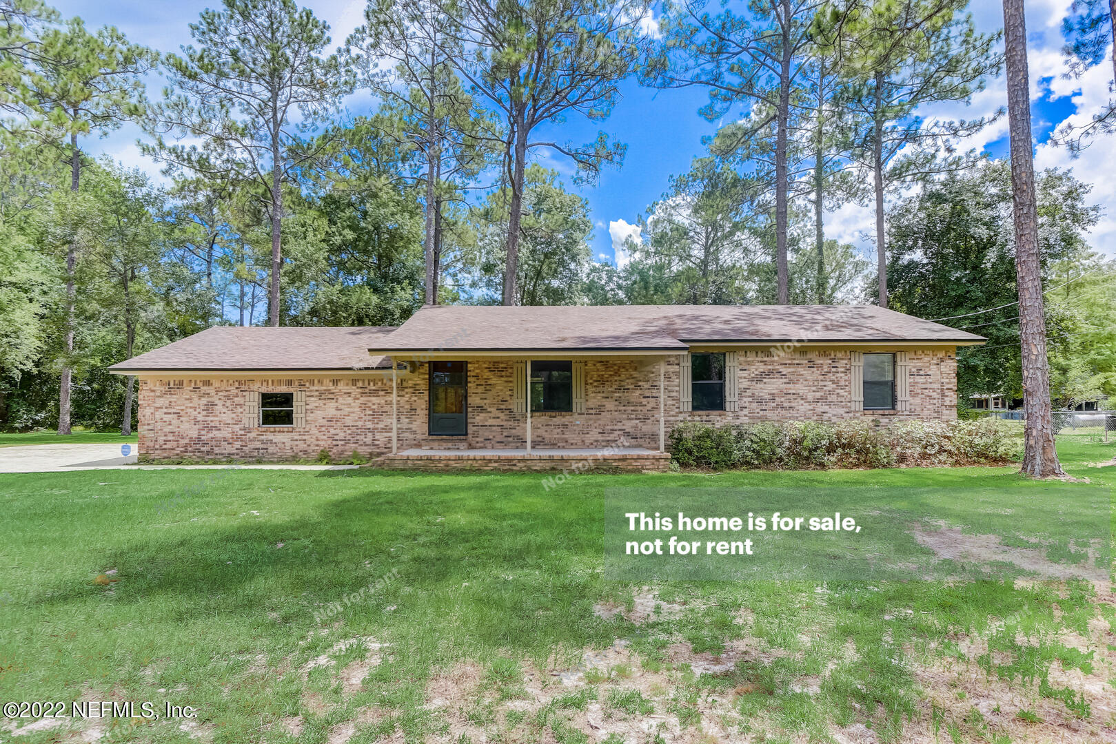 12348 Old Plank Road Jacksonville, FL 32220 - Photo 1 of 25 a front view of a house with a garden