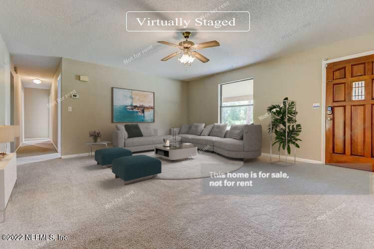 12348 Old Plank Road Jacksonville, FL 32220 - Photo 2 of 25 a living room with furniture and a chandelier