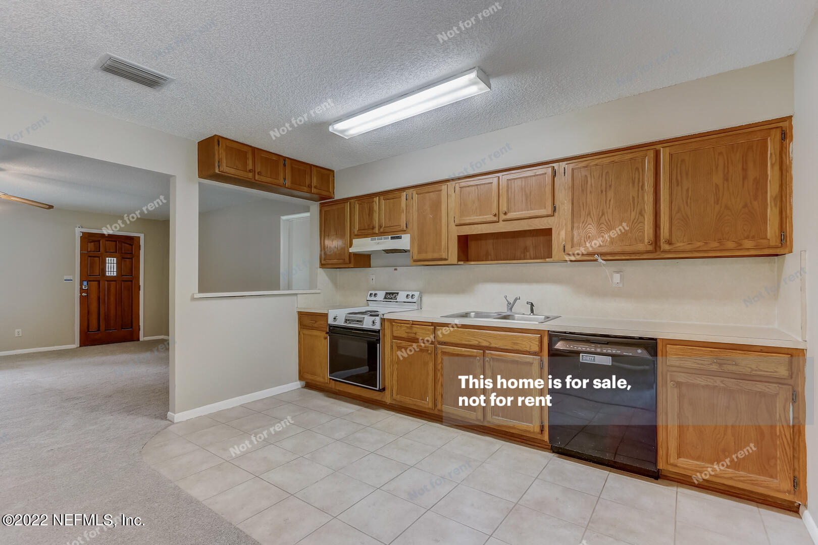 12348 Old Plank Road Jacksonville, FL 32220 - Photo 4 of 25 a kitchen with stainless steel appliances granite countertop a stove and a refrigerator