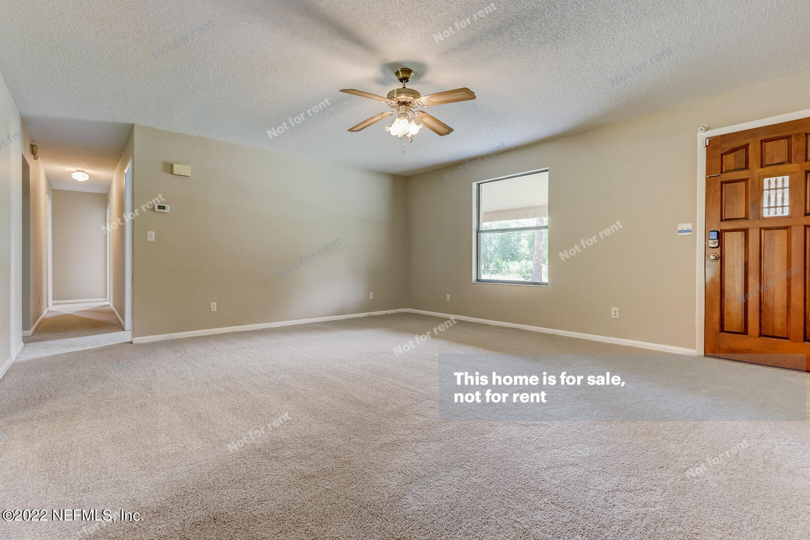 12348 Old Plank Road Jacksonville, FL 32220 - Photo 5 of 25 an empty room with windows and fan