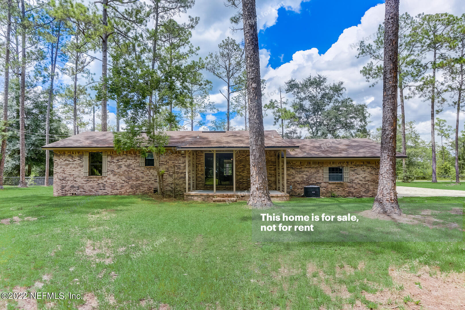 12348 Old Plank Road Jacksonville, FL 32220 - Photo 7 of 25 a front view of a house with a garden