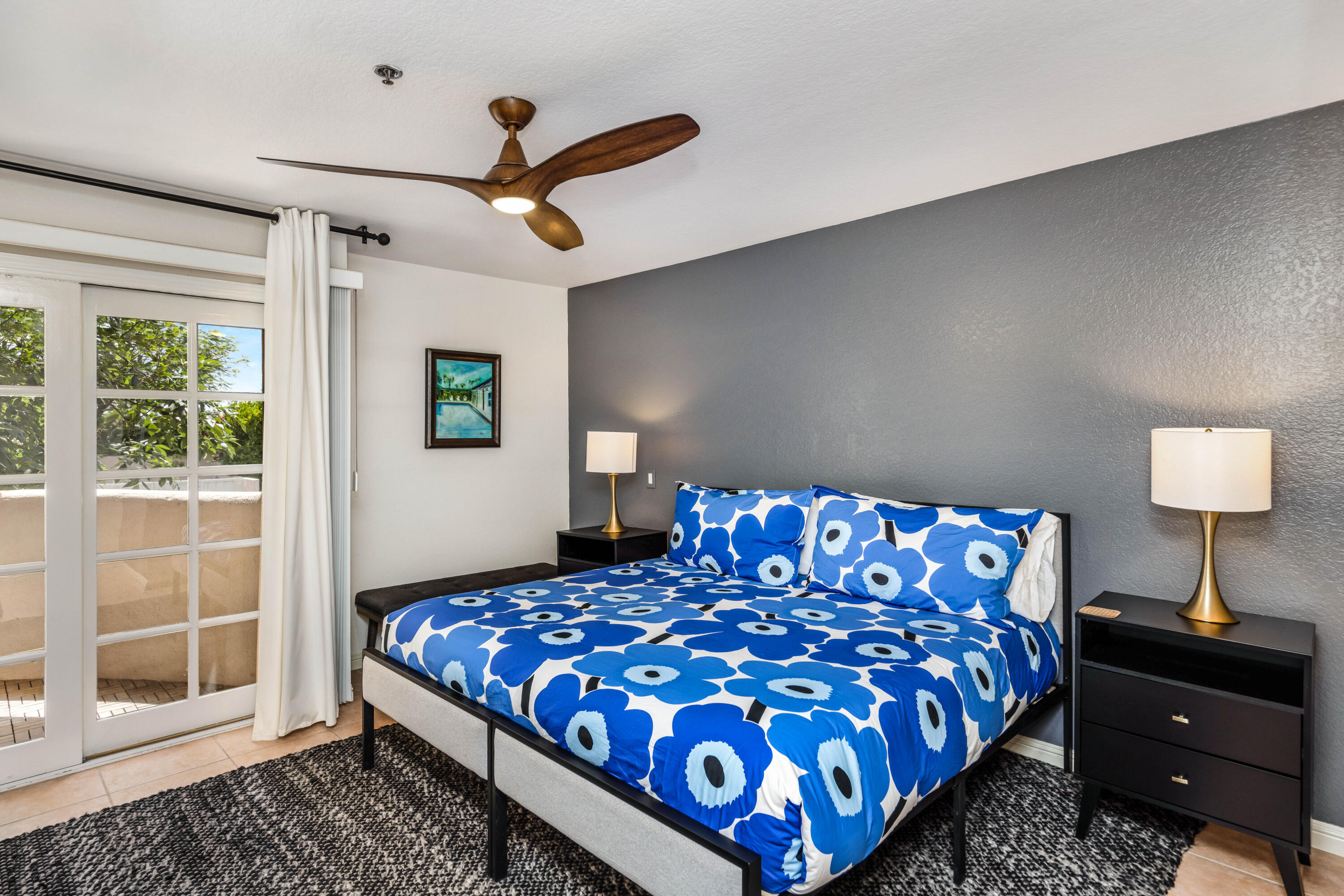 500 East Amado Road, Unit 512 Palm Springs, CA 92262 - Photo 19 of 37 a bedroom with a large bed and a window