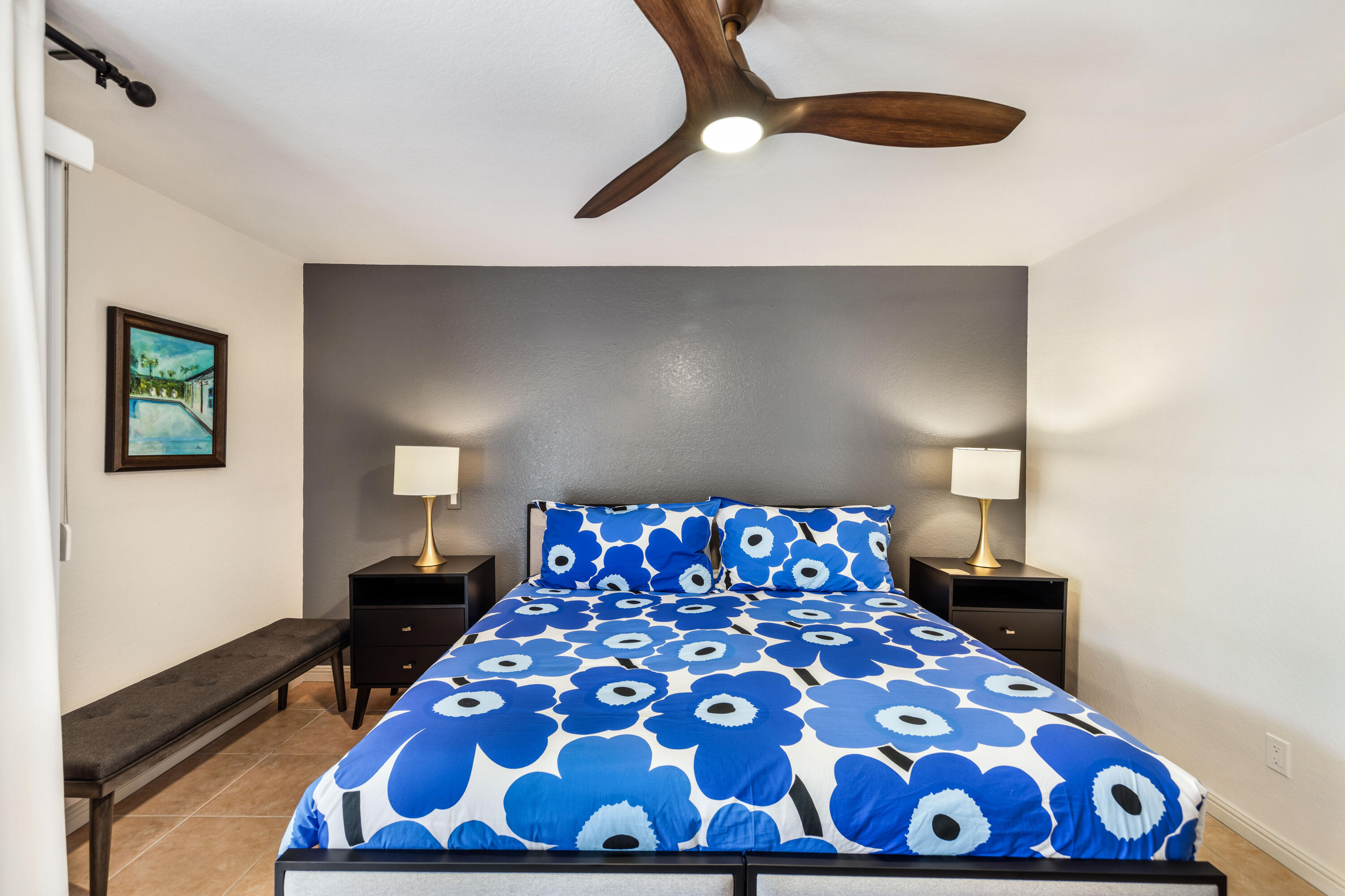 500 East Amado Road, Unit 512 Palm Springs, CA 92262 - Photo 20 of 37 a bedroom with a large bed and a chandelier