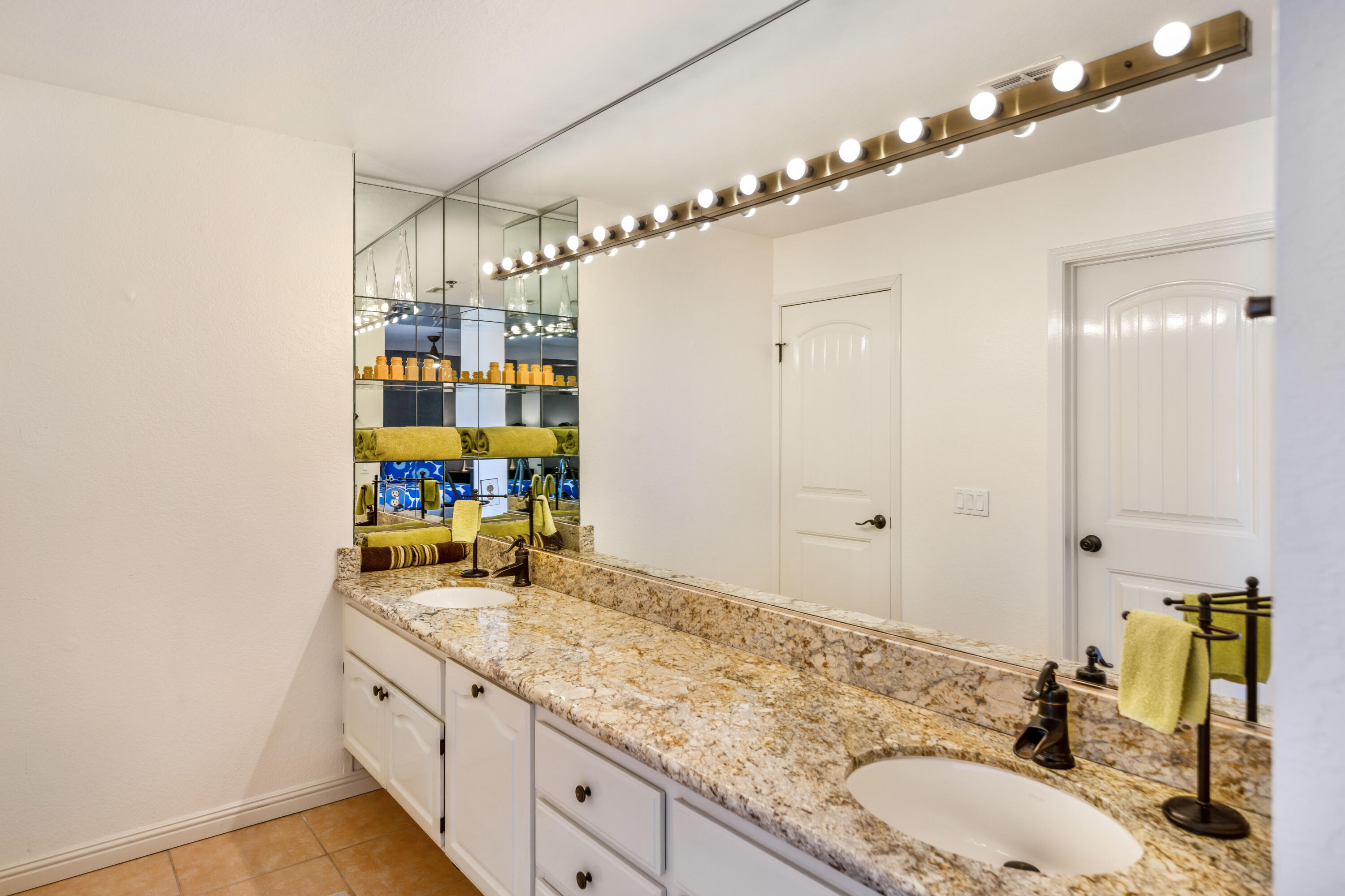 500 East Amado Road, Unit 512 Palm Springs, CA 92262 - Photo 22 of 37 a bathroom with a sink double vanity and shower