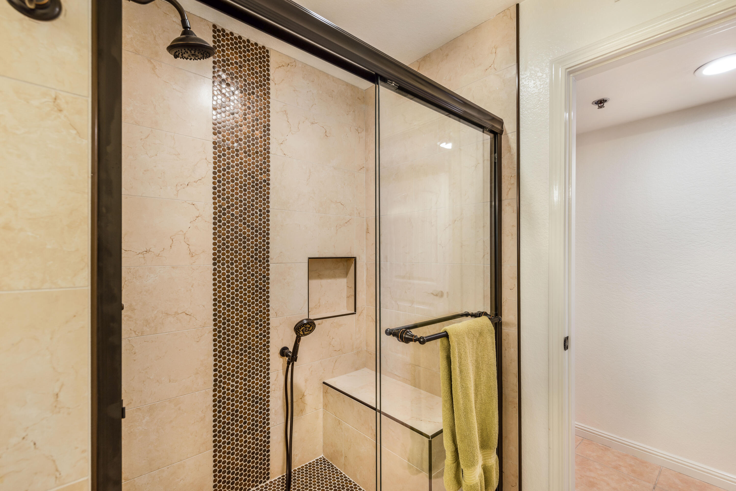 500 East Amado Road, Unit 512 Palm Springs, CA 92262 - Photo 29 of 37 a bathroom with a shower and a mirror