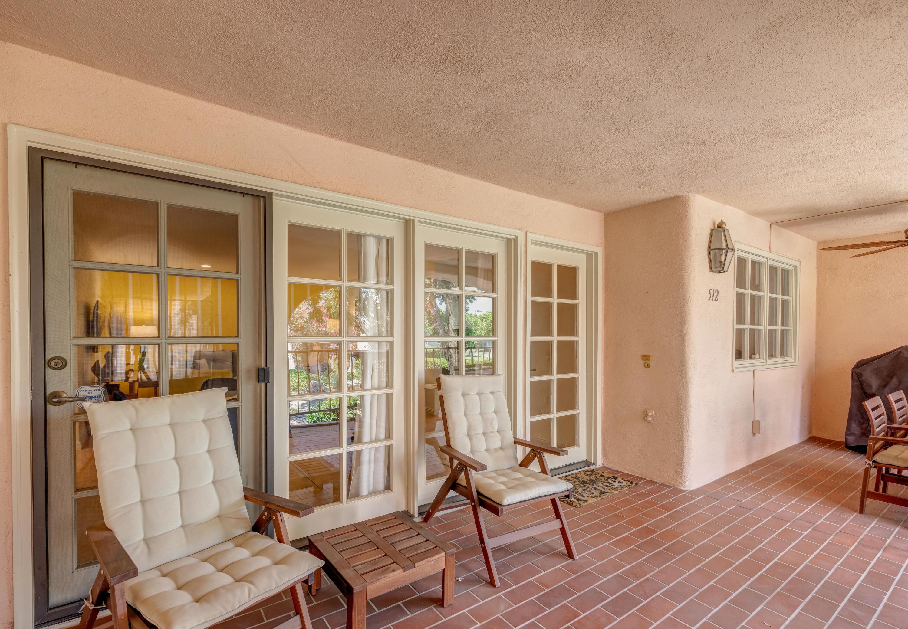 500 East Amado Road, Unit 512 Palm Springs, CA 92262 - Photo 5 of 37 a living room with furniture and a window