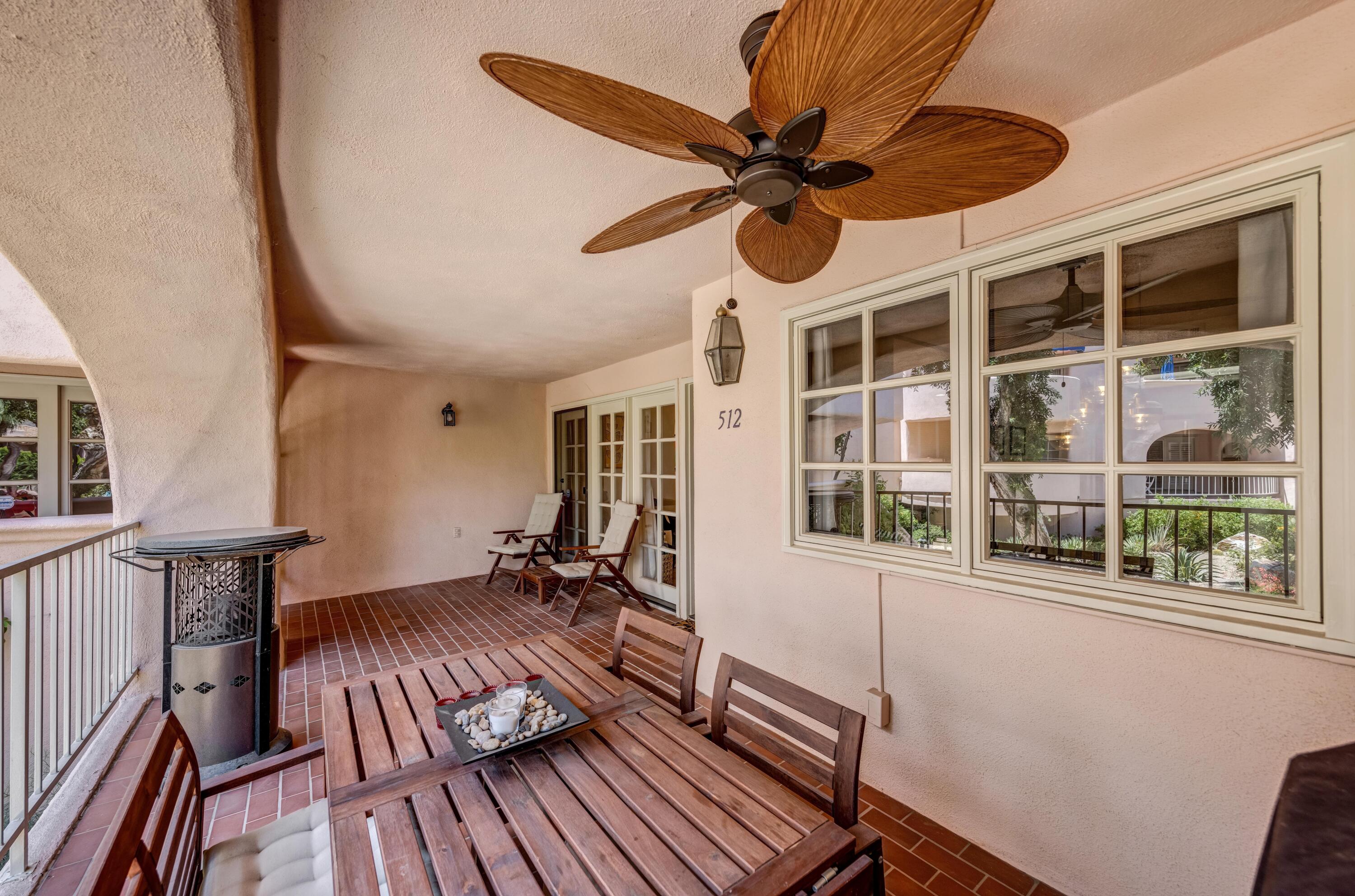 500 East Amado Road, Unit 512 Palm Springs, CA 92262 - Photo 6 of 37 a view of a dining room with furniture window and wooden floor