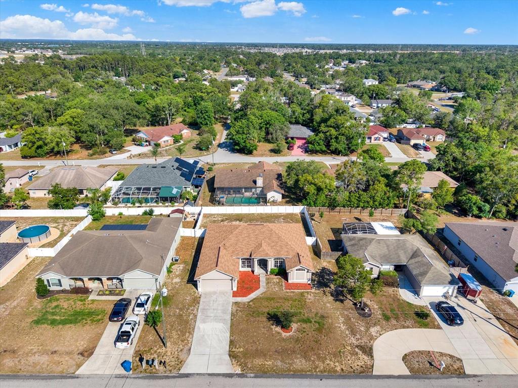 4400 Dior Road Spring Hill, FL 34609 - Photo 37 of 37 an aerial view of residential houses with outdoor space