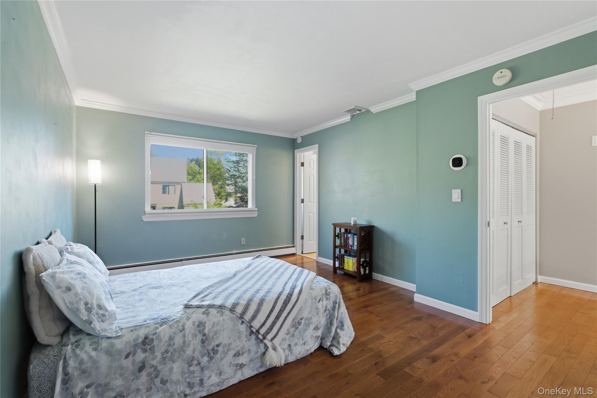 245 Tree Top Crescent Rye Brook, NY 10573 - Photo 8 of 24 a bedroom with a bed and a window