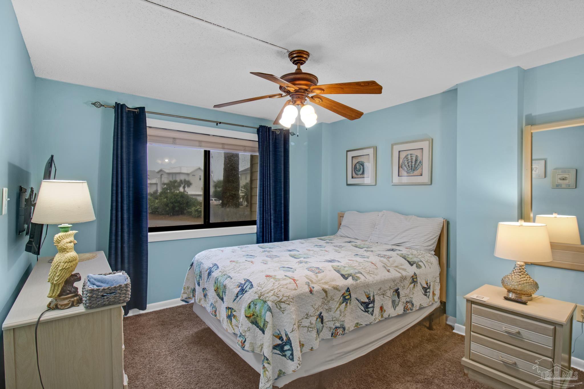 900 Fort Pickens Road, Unit 813 Pensacola Beach, FL 32561 - Photo 16 of 30 a bedroom with bed and a window