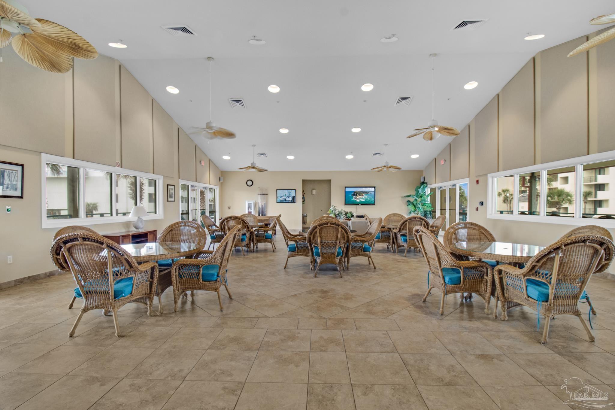 900 Fort Pickens Road, Unit 813 Pensacola Beach, FL 32561 - Photo 24 of 30 a view of a dining area with furniture