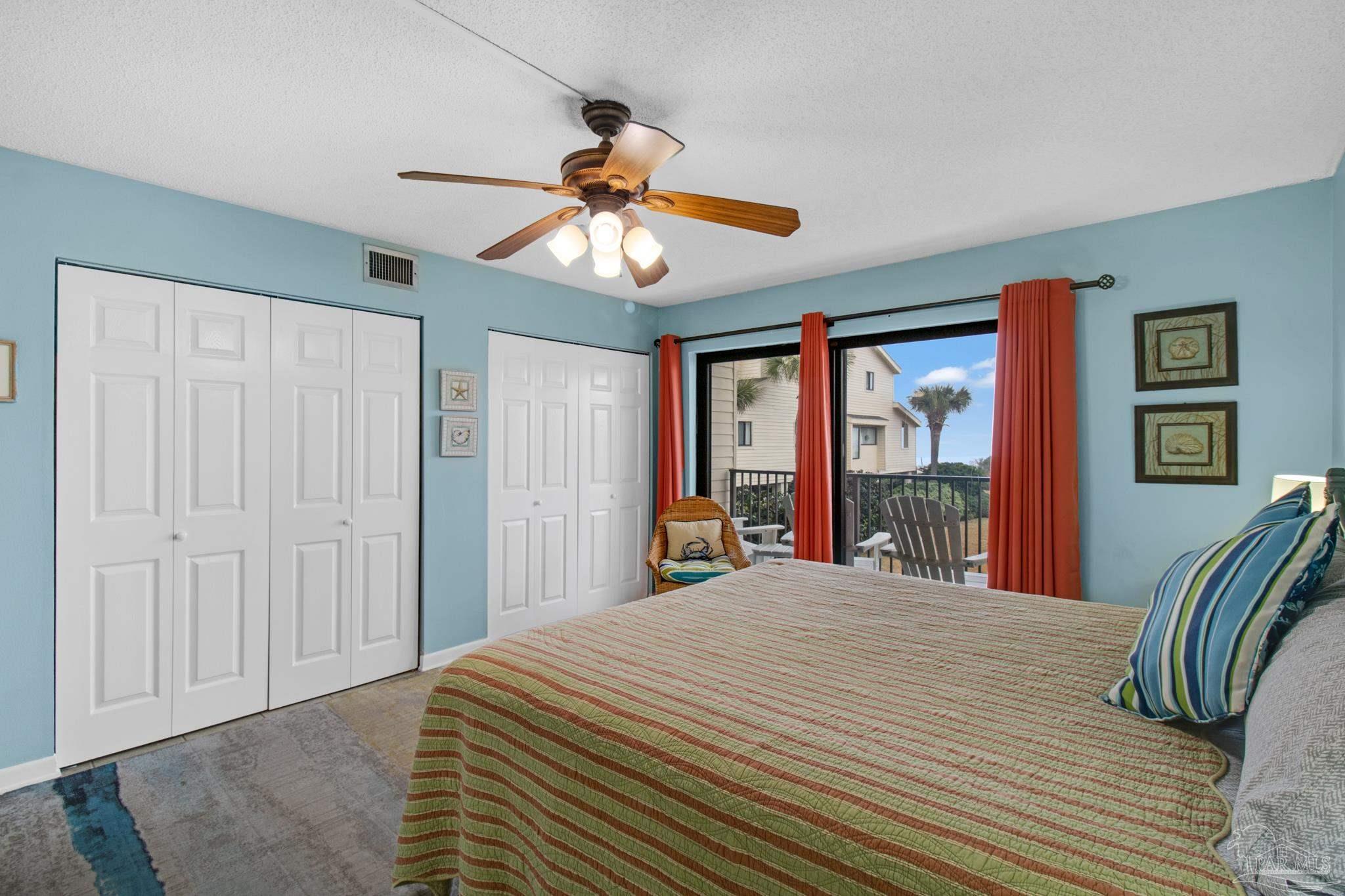 900 Fort Pickens Road, Unit 813 Pensacola Beach, FL 32561 - Photo 10 of 30 a bedroom with a large bed and a large window