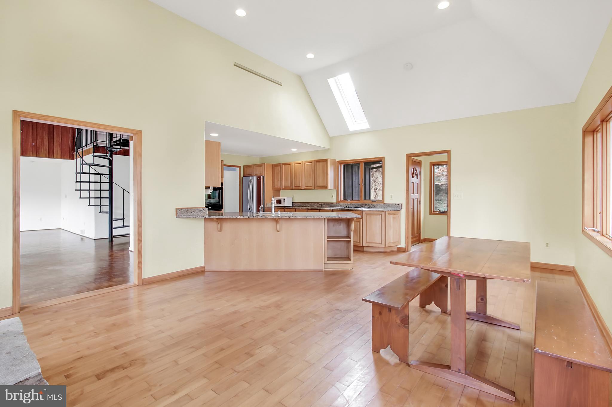 16611 Jm Pearce Road Monkton, MD 21111 - Photo 6 of 94 Kitchen w/angled bar & seating opens to great room