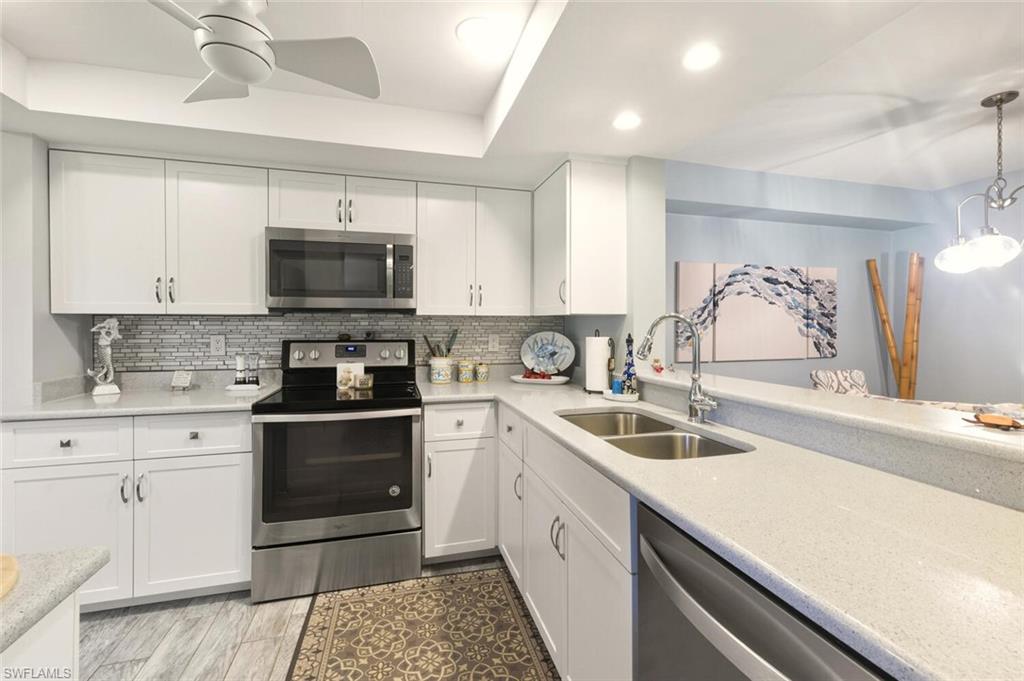 7380 St Ives Way, Unit 1108 Naples, FL 34104 - Photo 10 of 46 QUARTZ COUNTER ON SHAKER CABINETS