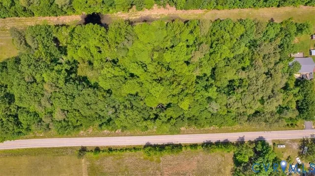 a view of swimming pool with lawn chairs