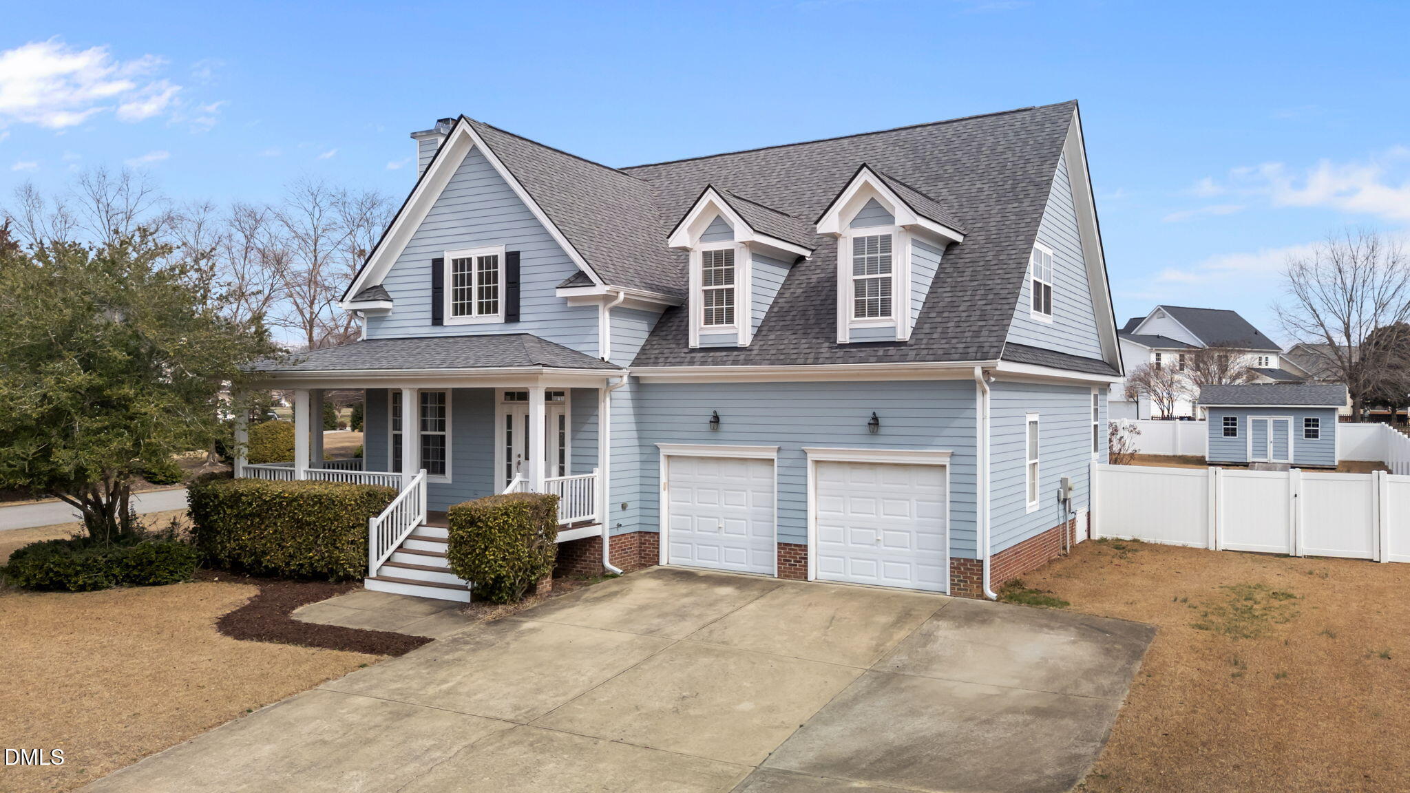 7101 Numa Circle Willow Spring, NC 27592 - Photo 43 of 44 a front view of a house with a yard and garage