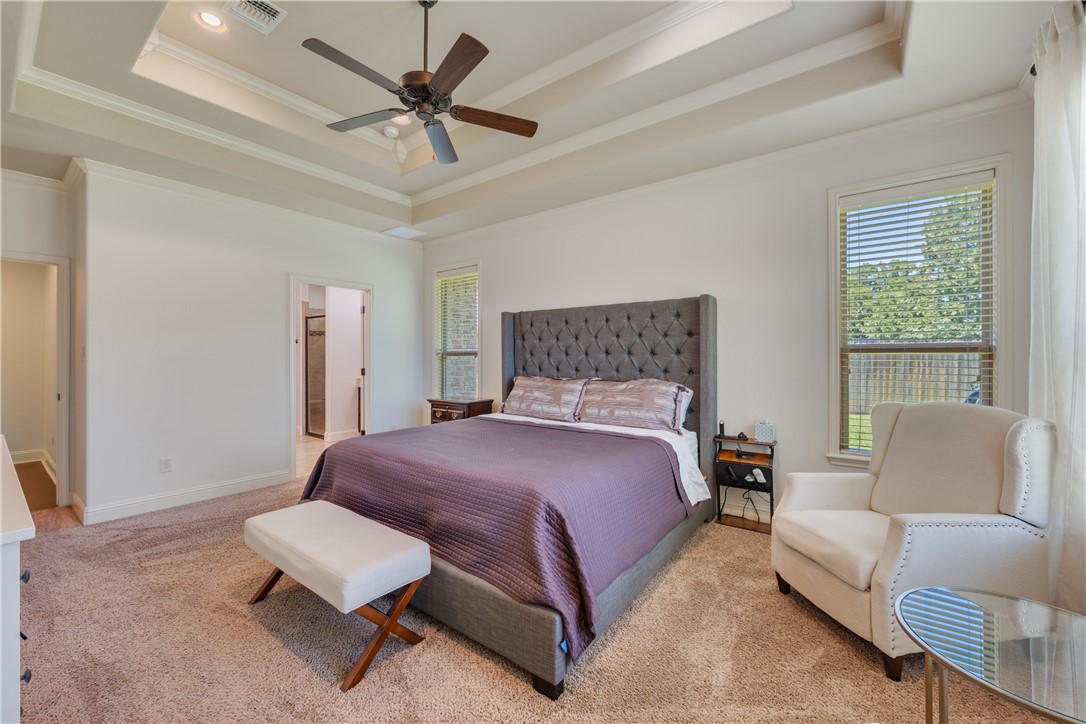 3301 Covington Court Bryan, TX 77808 - Photo 11 of 26 a bedroom with a bed a couch and a window