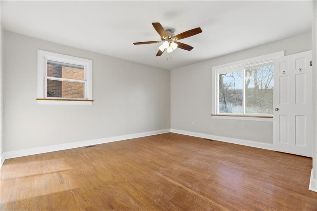 84 Hall Avenue Pittsburgh, PA 15205 - Photo 11 of 34 a view of an empty room with wooden floor and a window
