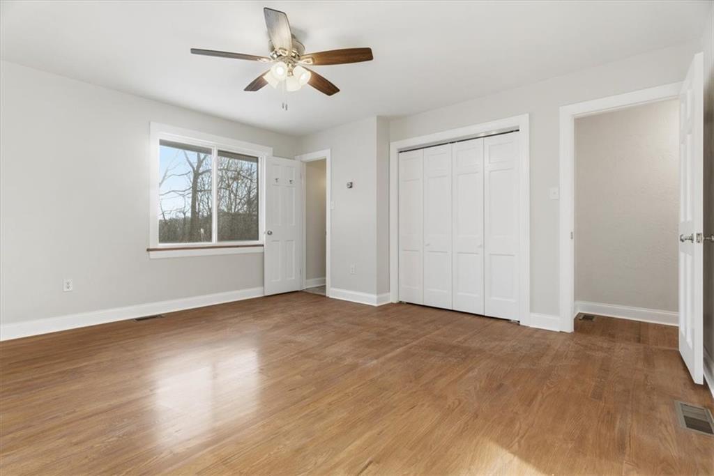 84 Hall Avenue Pittsburgh, PA 15205 - Photo 12 of 34 a view of an empty room with a window and wooden floor