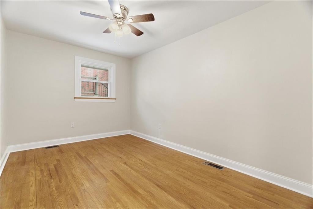84 Hall Avenue Pittsburgh, PA 15205 - Photo 15 of 34 an empty room with a window and a ceiling fan